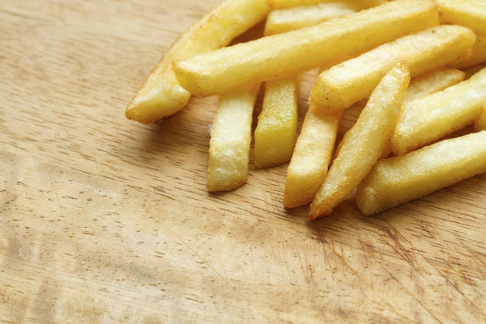 French Fries on wooden table